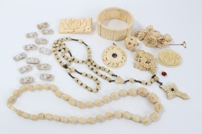 Lot 14 - Group of antique ivory, bone and similar  jewellery to include a 1920s carved ivory pendant with central amethyst cabochon, finely carved 19th century Dieppe ivory brooch depicting roses, and other...