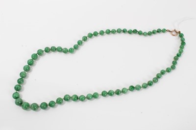 Lot 15 - Old Chinese jade/green hardstone bead necklace with a string of graduated spherical beads measuring approximately 6 to 9mm diameter, approximately 54cm length