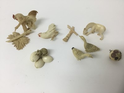 Lot 73 - Japanese carved ivory okimino of a rat on a pile of nuts, together with a Japanese shibyama bead and two animal groups
