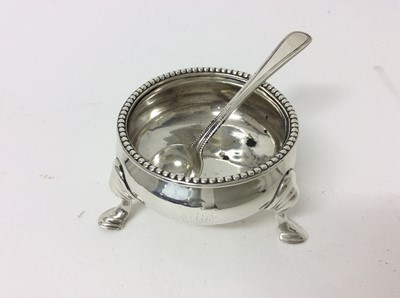 Lot 177 - Victorian silver cauldron salt with beaded border, on three hoof feet (London 1871), together with a Victorian silver beaded salt spoon (London 1869), all at 2.7ozs
