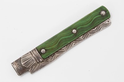 Lot 100 - Georgian silver soft fruit folding pocket knife with engraved silver blade, cast shell motives and wave carved and green stained ivory side plates, 15 cm open