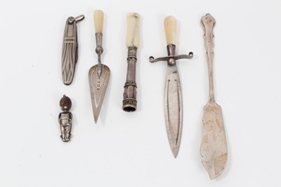 Lot 106 - Two Edwardian silver and mother of pearl trowel and sword book marks and other silver novelty items (7)