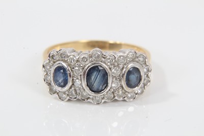 Lot 30 - Sapphire and diamond triple cluster ring with three oval mixed cut blue sapphires surrounded by brilliant cut diamonds estimated to weigh approximately 0.50cts in total, on 18ct gold shank. Ring si...