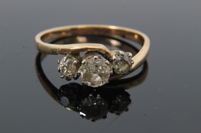 Lot 37 - Diamond three stone ring with three old cut diamonds in cross-over claw setting on 9ct gold shank. Estimated total diamond weight approximately 0.65cts. Ring size O½