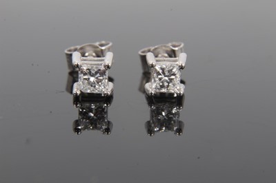 Lot 39 - Pair of diamond single stone earrings, each with a princess cut diamond in 18ct white gold four claw setting, hallmarked London 2004. Estimated total diamond weight approximately 0.40cts