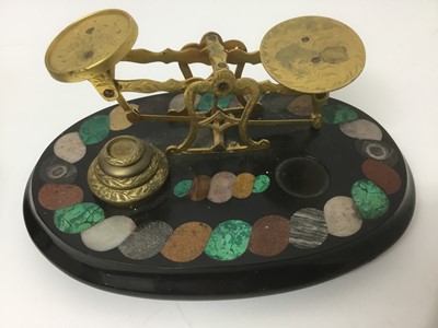 Lot 169 - Victorian pietra dura inlaid postal scales, oval form with specimen stone inlaid borders with four graduated weights (one matched), bun feet, 24cm wide