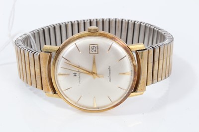 Lot 145 - 1960s Gentleman's Hamilton calendar wristwatch in yellow metal case - probably 18ct with silvered dial on expanding bracelet.The case 34mm