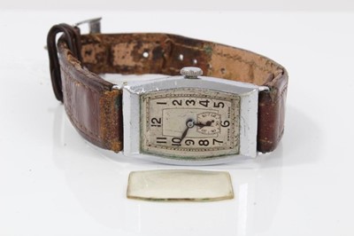 Lot 184 - Art Deco mid-size wristwatch with tonneau shape dial in chromium plated case on leather strap