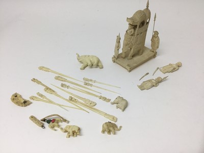 Lot 317 - 19th century carved Indian elephant and riders group, with attendant figures, on rectangular plinth, approximately 10cm wide, together with various carved ivory elephant figures, toothpicks and oth...