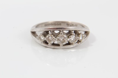 Lot 185 - Diamond five stone ring with five graduated brilliant cut diamonds in claw setting within a white gold border on plain shank. Signed 'Starlight', hallmarked Birmingham 1994, ring size Q½. Estimated...