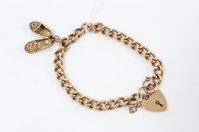 Lot 214 - 9ct gold bracelet charm, hung with shoe charms, with padlock clasp 
total weight 26g