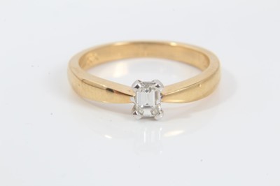 Lot 248 - Diamond single stone ring with a rectangular step-cut diamond estimated to weigh approximately 0.25cts in four claw setting on 18ct yellow gold shank. Ring size L½.