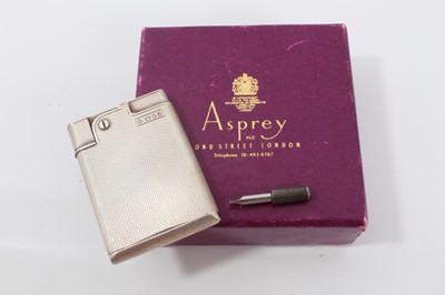 Lot 307 - Vintage Asprey silver pocket lighter with engine turned decoration
