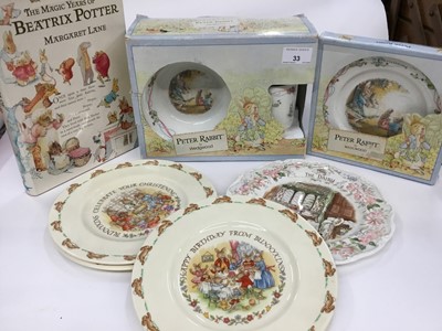 Lot 33 - Wedgwood Peter Rabbit boxed christening sets, three Royal Doulton Bunnykins plates, Royal Doulton Bramley Hedge plate and a Beatrix Potter book