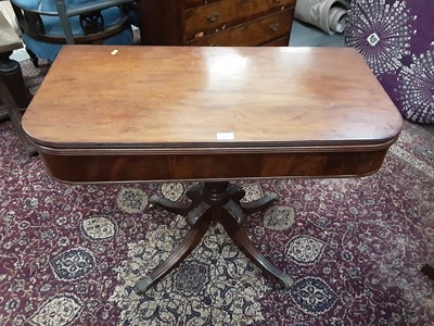 Lot 107 - Regency mahogany card table with fold over top on carved and turned column and four splayed legs, 91cm wide