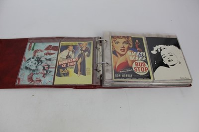 Lot 1118 - Postcards - Marilyn Munro printed and reproduction, advertising and pin ups. In two albums.