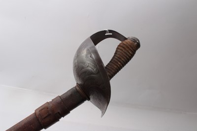 Lot 315 - First World War George V 1912 Pattern Cavalry Officers' sword with scroll engraved bowl guard, plain straight blade sharpened for active service in pigskin scabbard.
