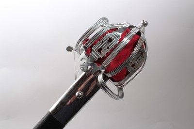 Lot 326 - Reproduction Scottish Claymore broad sword  with basket hilt, broad fullered blade in steel mounted scabbard