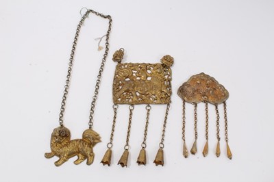 Lot 4 - Old Chinese gilt metal panel necklace decorated with a figure riding a dragon, one other gilt metal figurative panel and a gilt metal dog of foo necklace