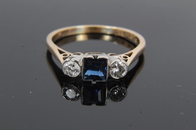 Lot 25 - 18ct gold diamond and sapphire three stone ring