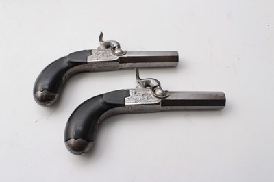 Lot 373 - Fine cased pair Mid-19th century Belgian percussion muff pistols with off set box locks, turn off octagonal rifled barrels with Liege proofs , concealed triggers and ebony bag grips with concealed...