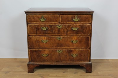Lot 719 - Rare George I yew and fruitwood veneered chest of two short and three long drawers with original brass handles on bracket feet