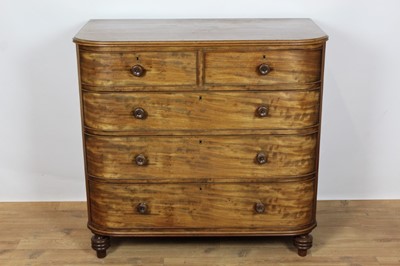 Lot 721 - George IV mahogany bow front chest of two short and three long drawers with turned mahogany handles on turned feet