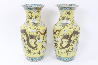 Lot 6 - Pair 19th century Chinese Dayazhai-style porcelain baluster vases, decorated with dragons amongst flowers, on a yellow ground, 35cm height