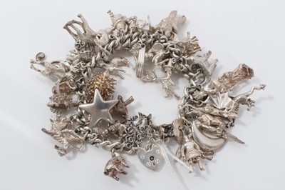 Lot 161 - Silver charm bracelet with padlock clasp