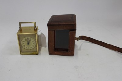 Lot 1998 - Early 20th century French carriage clock in brass case, approximately 10.5cm high, in original leather travelling case with key