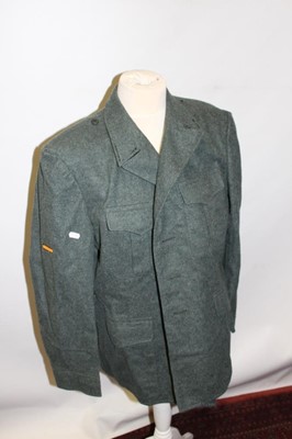 Lot 298 - One box of assorted Militaria to include uniforms, Military torches and plaques