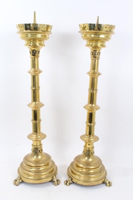 Lot 244 - Pair of large 19th century gothic brass church pricket candlesticks together with a similar table/floor standing lamp