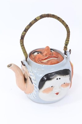 Lot 31 - Japanese Banko ware five faces teapot with cane work handle, impressed mark to base, 13.5cm height not including handle