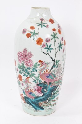 Lot 43 - Antique Chinese Qing period semi-eggshell porcelain vase with a textured surface, decorated in a famille rose palette with two hoho birds in a stream, surrounded by flowers and foliage, 26cm height