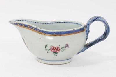 Lot 58 - Antique Chinese famille rose Armorial porcelain sauce boat, c.1800, the armorial at the front with motto reading 'Sit Ordo In Omnibus', the sides with floral sprays, patterned borders and double st...