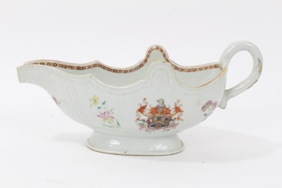 Lot 59 - Antique 18th century Chinese famille rose Armorial porcelain sauce boat, the armorial painted on both sides, the motto faded but appears to read 'Mea Fides Gloria', adorned with floral sprays, 24cm...