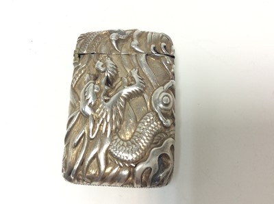 Lot 167 - Chinese white metal vesta case of conventional form with embossed dragon decoration, and hinged cover, 5cm in length