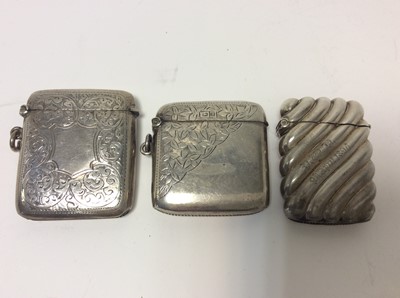 Lot 168 - George V silver vesta case with engraved foliate decoration (Birmingham 1911), together with two other silver vesta cases (various dates and makers), all at approximately 4oz (3)