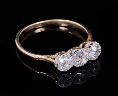 Lot 352 - Antique diamond three stone ring with three old cut diamonds in claw setting on 18ct yellow gold shank. Estimated total diamond weight approximately 0.90ct. Ring size M½.