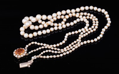 Lot 363 - Cultured pearl necklace with a string of graduated cultured pearls measuring approximately 3mm - 6mm on a 9ct gold and diamond clasp, 45cm length, together with another cultured pearl necklace with...