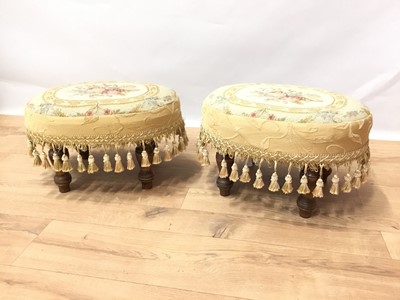 Lot 878 - Pair of tapestry upholstered footstool, of oval form with tassel frieze on turned legs, 39cm wide