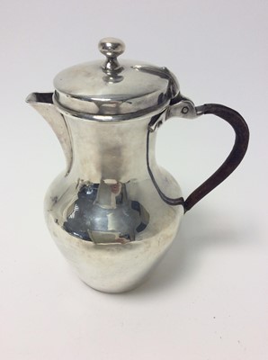 Lot 157 - Victorian silver hot water pot of baluster form with angular spout, hinged cover and leather covered loop handle (London 1880), all at approximately 16oz, approximately 19cm in height