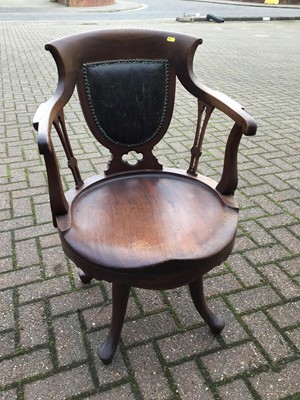 Lot 75 - Mahogany swivel elbow chair