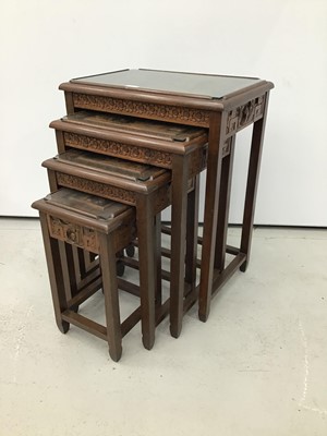 Lot 7 - Chinese carved wooden nest of three coffee tables
