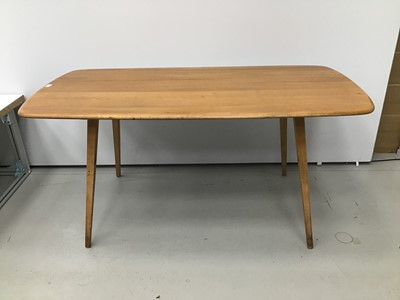 Lot 39 - Ercol golden dawn dining table and ensuite set of four chairs
