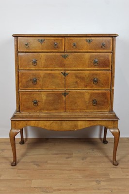 Lot 724 - Queen Anne walnut and crossbanded chest (converted to a drinks cabinet) on later stand