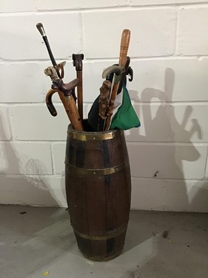 Lot 96 - 19th century brass bound coopered oak barrel, together with a collection of modern walking sticks etc