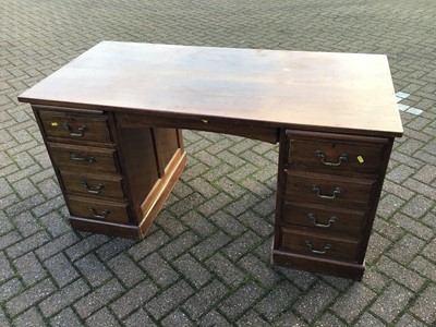 Lot 101 - Early 20th century mahogany twin pedestal desk, with rectangular plank top and nine drawers about the kneehole on plinth bases, 137 cm wide x 69cm deep x 70cm high