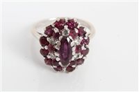 Lot 3353 - White gold ruby and diamond cluster ring with...