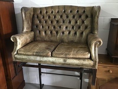 Lot 125 - Good quality Georgian style green leather wing back two-seater settee with buttoned back, loose seat cushions, brass studded edge on moulded square chamfered legs joined by stretchers, approximatel...